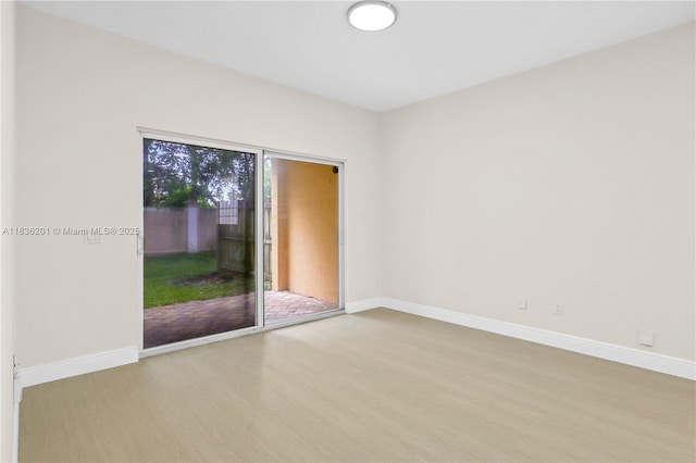 798 Quartz Ter, Palm Beach, FL 33413 - unfurnished room with wood finished floors and baseboards