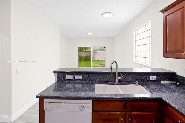 798 Quartz Ter, Palm Beach, FL 33413 - kitchen with dishwasher, dark brown cabinets, dark stone counters, and recessed lighting