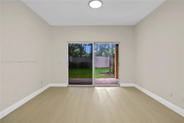 798 Quartz Ter, Palm Beach, FL 33413 - spare room featuring wood finished floors and baseboards