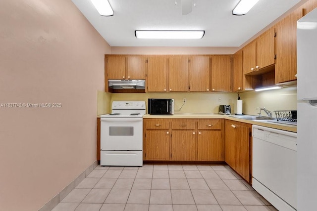 8280 SW 24th St Unit 7105, North Lauderdale, FL 33068 - kitchen featuring white appliances, under cabinet range hood, light countertops, and light tile patterned flooring