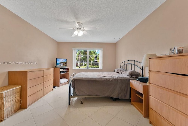 8280 SW 24th St Unit 7105, North Lauderdale, FL 33068 - bedroom featuring a textured ceiling, a ceiling fan, and light tile patterned floors