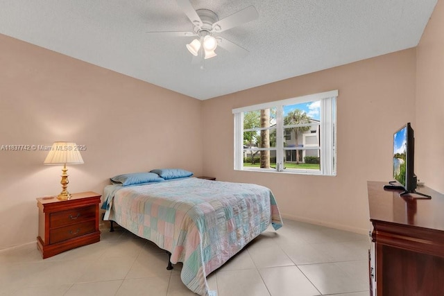 8280 SW 24th St Unit 7105, North Lauderdale, FL 33068 - bedroom with a textured ceiling, light tile patterned floors, and ceiling fan