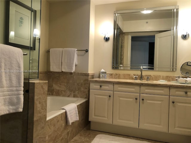 1435 Brickell Ave Unit 3106, Miami, FL 33131 - full bathroom featuring vanity, a bath, tile patterned floors, and a shower with shower door