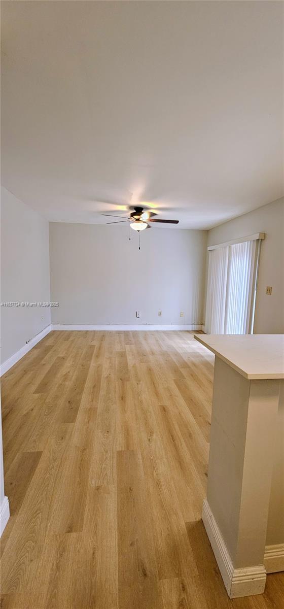 10194 SW 137th Ct Unit 10194, Miami, FL 33186 - spare room with light wood-style flooring and ceiling fan