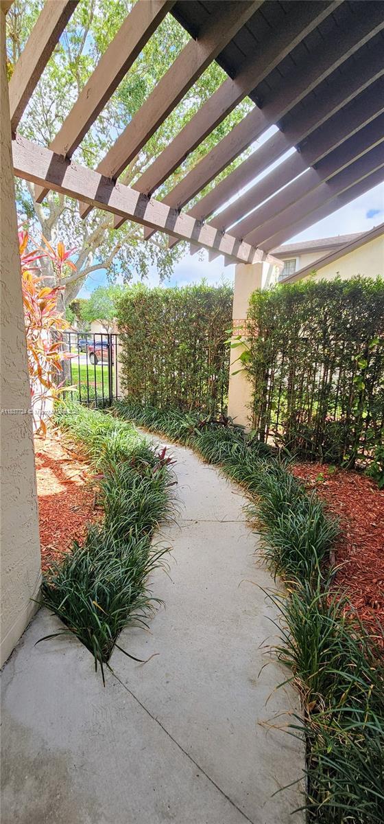 10194 SW 137th Ct Unit 10194, Miami, FL 33186 - view of home's community featuring a pergola