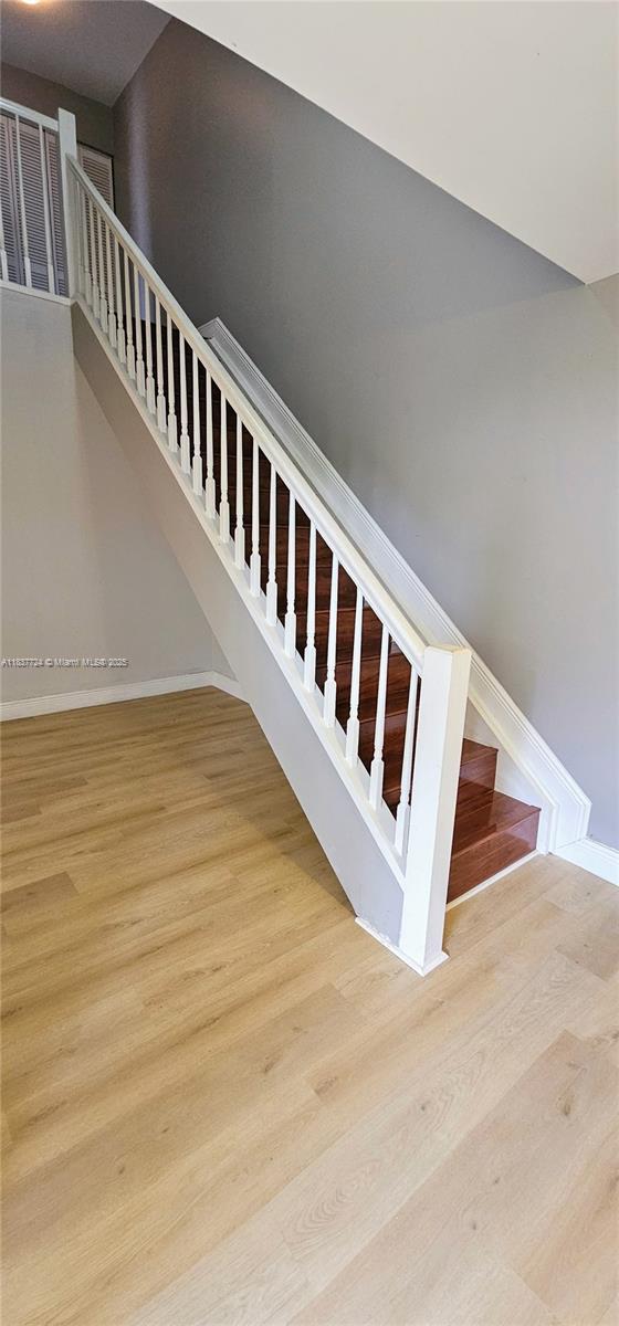 10194 SW 137th Ct Unit 10194, Miami, FL 33186 - staircase with wood finished floors