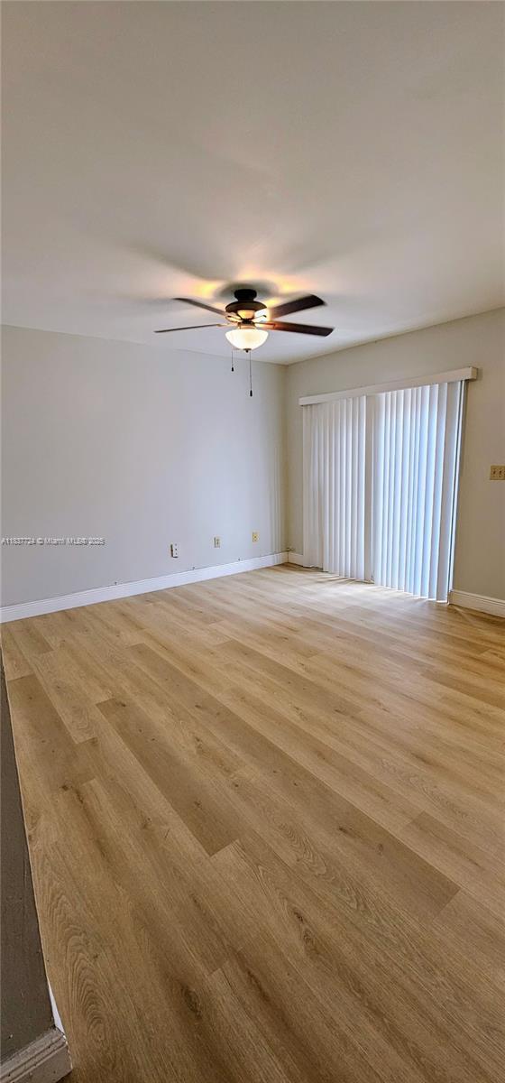 10194 SW 137th Ct Unit 10194, Miami, FL 33186 - empty room with ceiling fan and light wood-style flooring