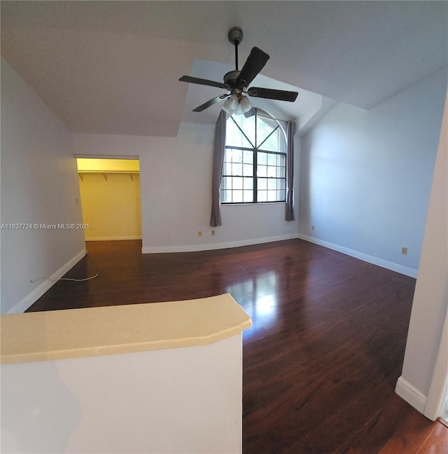 10194 SW 137th Ct Unit 10194, Miami, FL 33186 - empty room with vaulted ceiling, wood finished floors, and ceiling fan