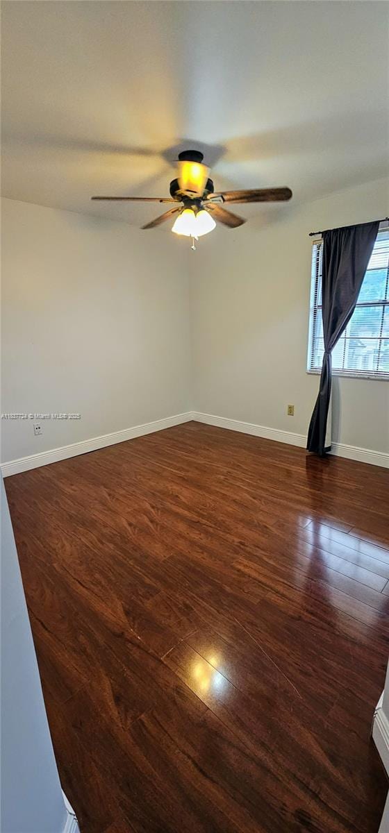 10194 SW 137th Ct Unit 10194, Miami, FL 33186 - empty room with dark wood-style flooring and ceiling fan