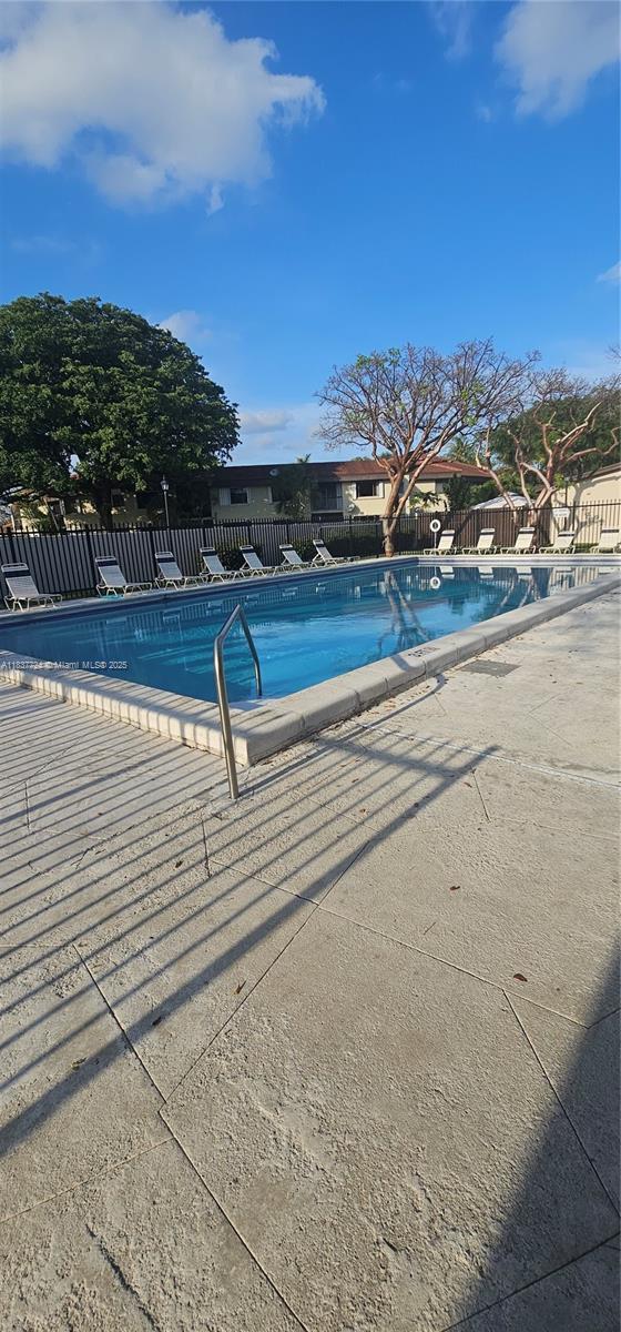 10194 SW 137th Ct Unit 10194, Miami, FL 33186 - community pool featuring a patio area