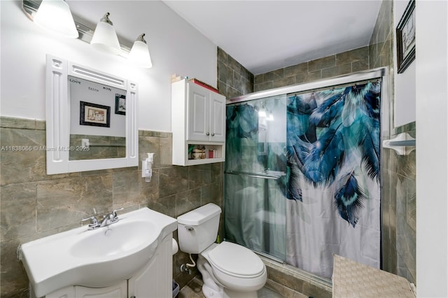 190 E 16th St, Hialeah, FL 33010 - full bathroom featuring tile walls, a shower stall, and vanity