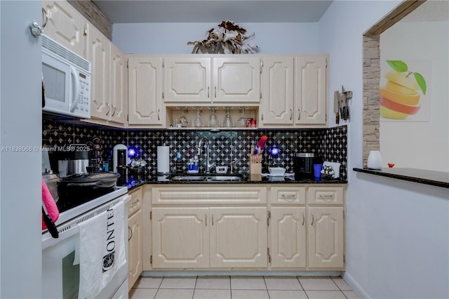 190 E 16th St, Hialeah, FL 33010 - kitchen with white appliances, light tile patterned flooring, decorative backsplash, open shelves, and dark stone countertops