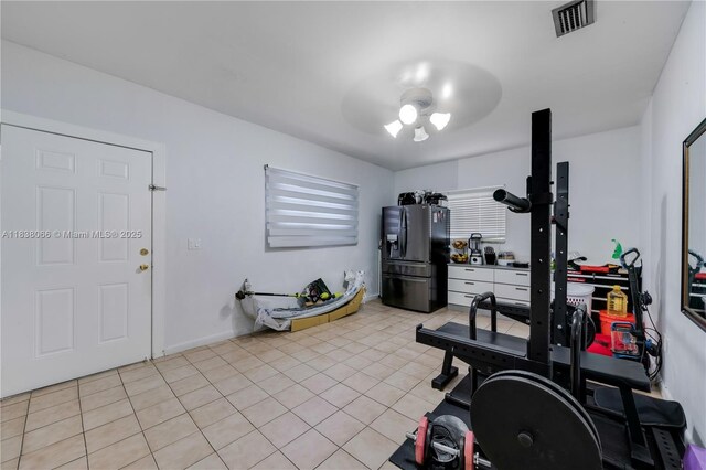 190 E 16th St, Hialeah, FL 33010 - exercise room featuring a ceiling fan and light tile patterned flooring
