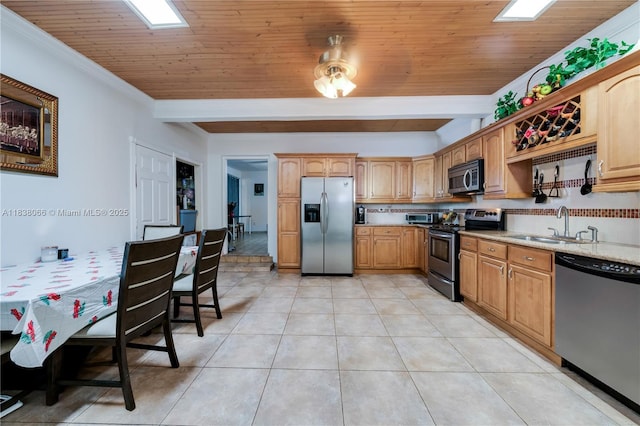 190 E 16th St, Hialeah, FL 33010 - kitchen with appliances with stainless steel finishes, light tile patterned floors, and crown molding