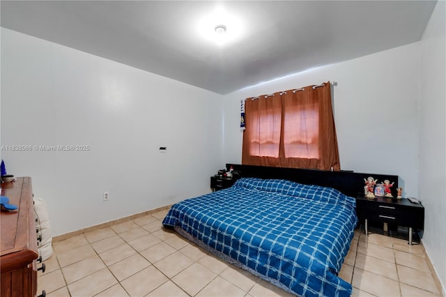 190 E 16th St, Hialeah, FL 33010 - bedroom with light tile patterned flooring