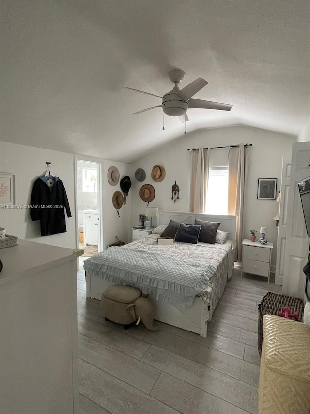 291 NW 95th St, Miami, FL 33150 - bedroom with lofted ceiling, light wood-style flooring, a ceiling fan, and ensuite bath
