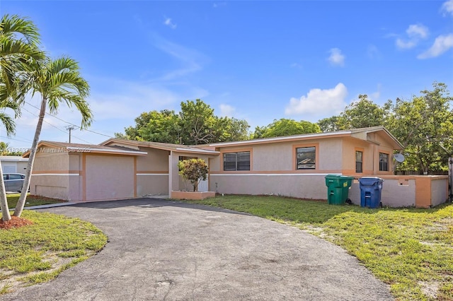 1160 NW 47th Ave, Lauderhill, FL 33313 - single story home with asphalt driveway, stucco siding, and a front yard