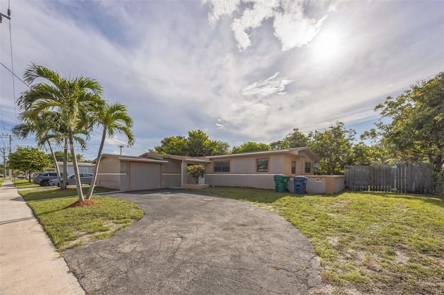 1160 NW 47th Ave, Lauderhill, FL 33313 - single story home featuring driveway, stucco siding, and a garage