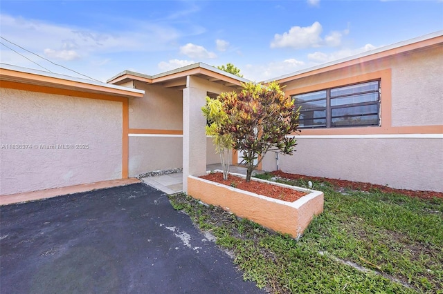 1160 NW 47th Ave, Lauderhill, FL 33313 - doorway to property featuring stucco siding