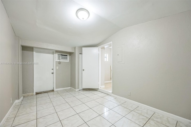 1160 NW 47th Ave, Lauderhill, FL 33313 - unfurnished room featuring vaulted ceiling, a wall mounted air conditioner, electric panel, and light tile patterned flooring