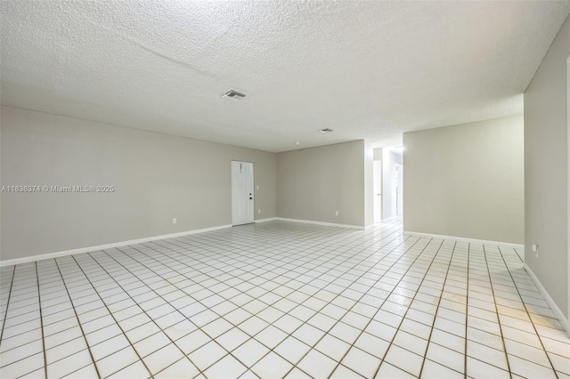 1160 NW 47th Ave, Lauderhill, FL 33313 - unfurnished room with light tile patterned flooring and a textured ceiling