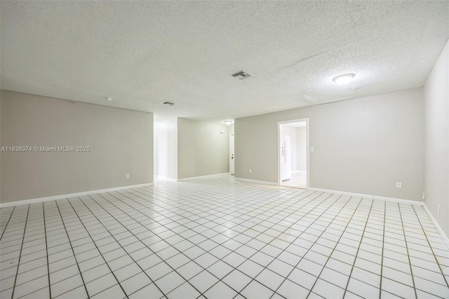 1160 NW 47th Ave, Lauderhill, FL 33313 - unfurnished room featuring light tile patterned floors and a textured ceiling