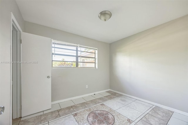 1160 NW 47th Ave, Lauderhill, FL 33313 - empty room featuring baseboards and light marble finish floors