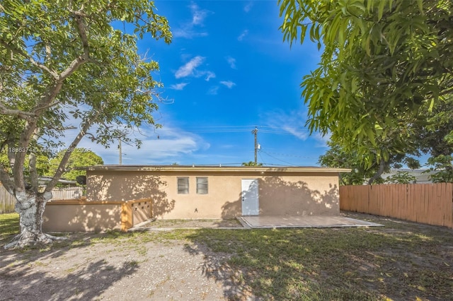 1160 NW 47th Ave, Lauderhill, FL 33313 - back of property featuring stucco siding and a patio