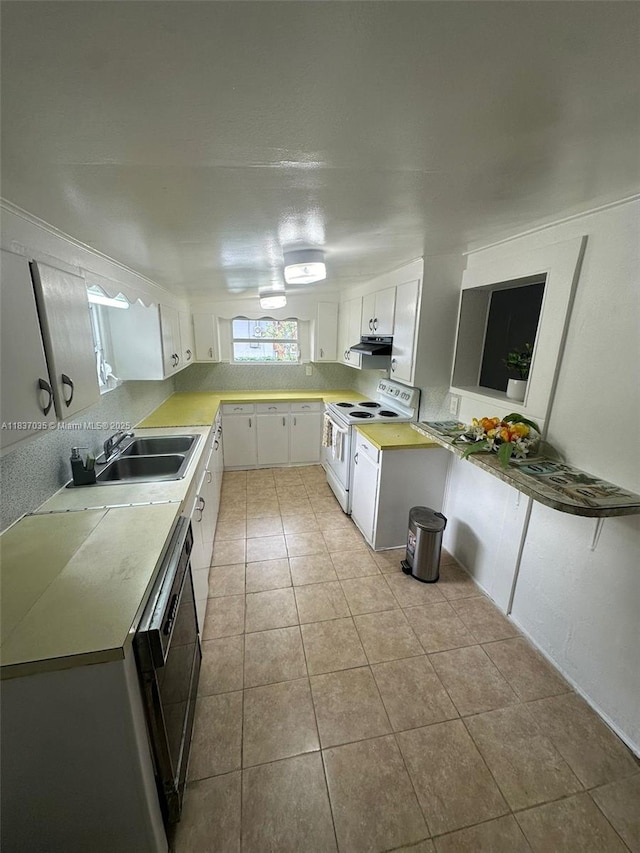 kitchen featuring white electric stove, white cabinetry, dishwasher, light tile patterned floors, and light countertops