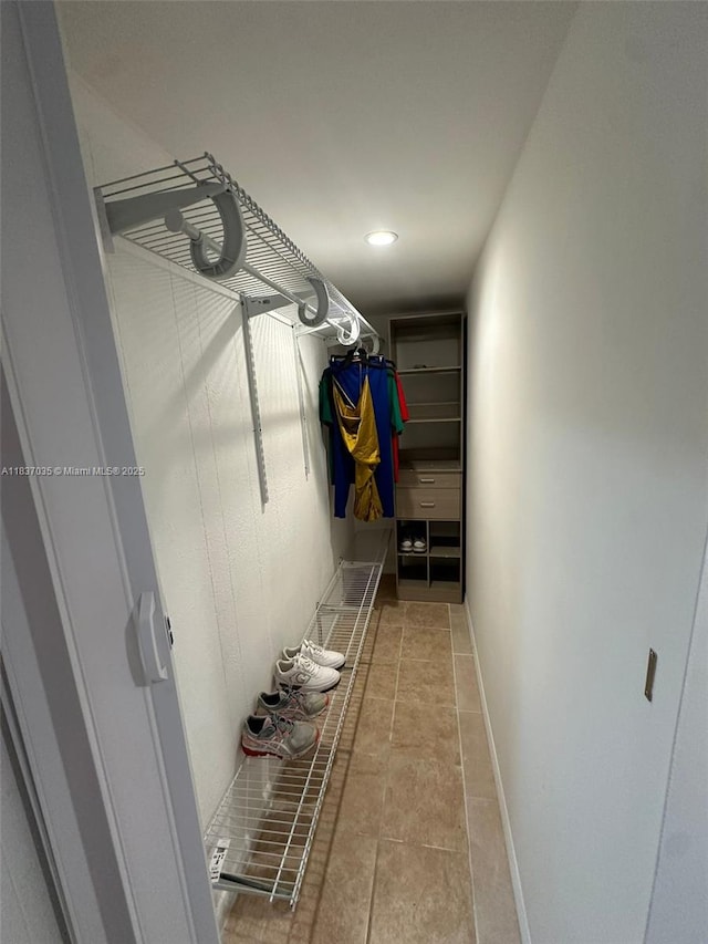 spacious closet with tile patterned flooring