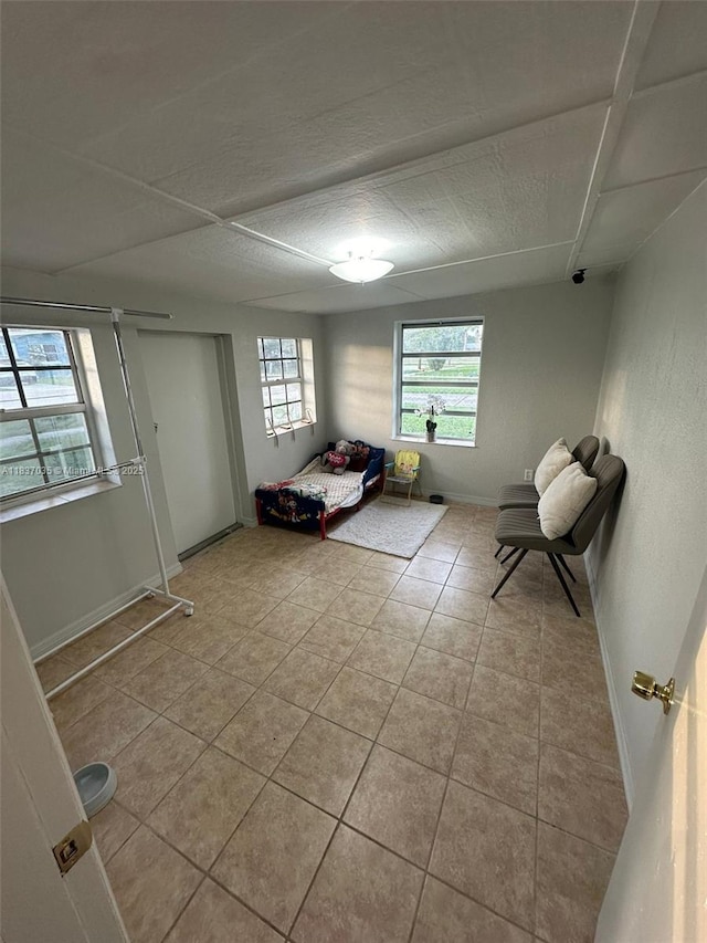 tiled bedroom with baseboards