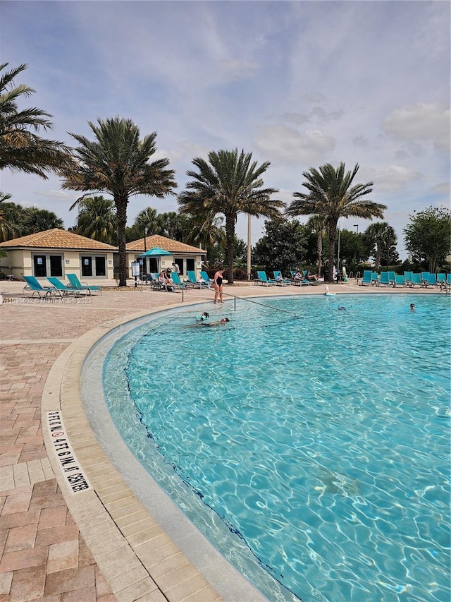 9338 Sommerset Hls, Kissimmee, FL 33896 - community pool featuring a patio area