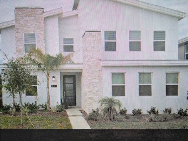 9338 Sommerset Hls, Kissimmee, FL 33896 - view of front facade featuring stone siding