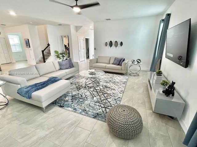 9338 Sommerset Hls, Kissimmee, FL 33896 - living area with a ceiling fan and stairway