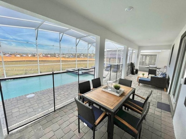 9338 Sommerset Hls, Kissimmee, FL 33896 - sunroom / solarium featuring a swimming pool and outdoor dining area