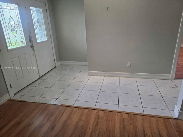 1744 SE Berkshire Blvd, Port St Lucie, FL 34952 - entrance foyer with baseboards and light wood-type flooring