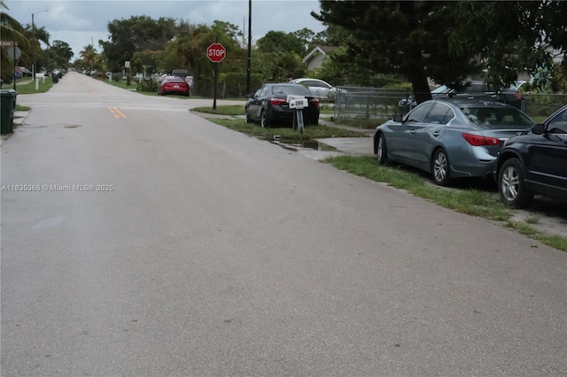 256 Broward Ave, Green Acres, FL 33463 - view of asphalt street featuring traffic signs