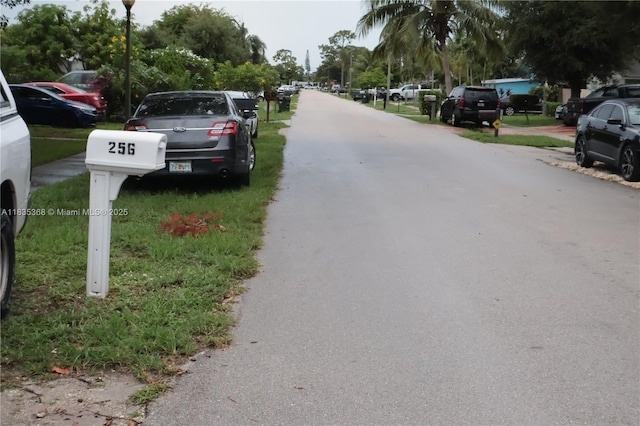 256 Broward Ave, Green Acres, FL 33463 - view of asphalt street with street lights
