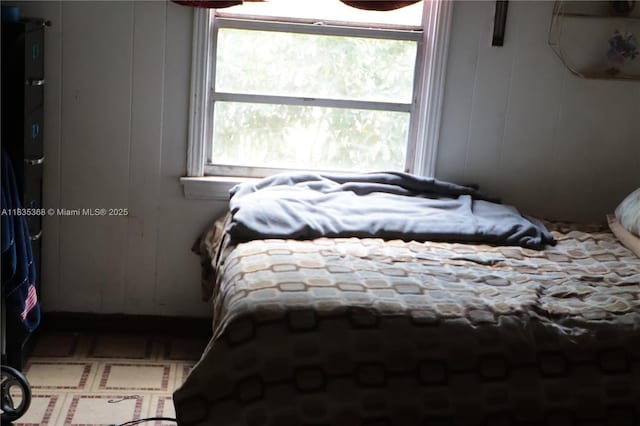 256 Broward Ave, Green Acres, FL 33463 - bedroom featuring a decorative wall