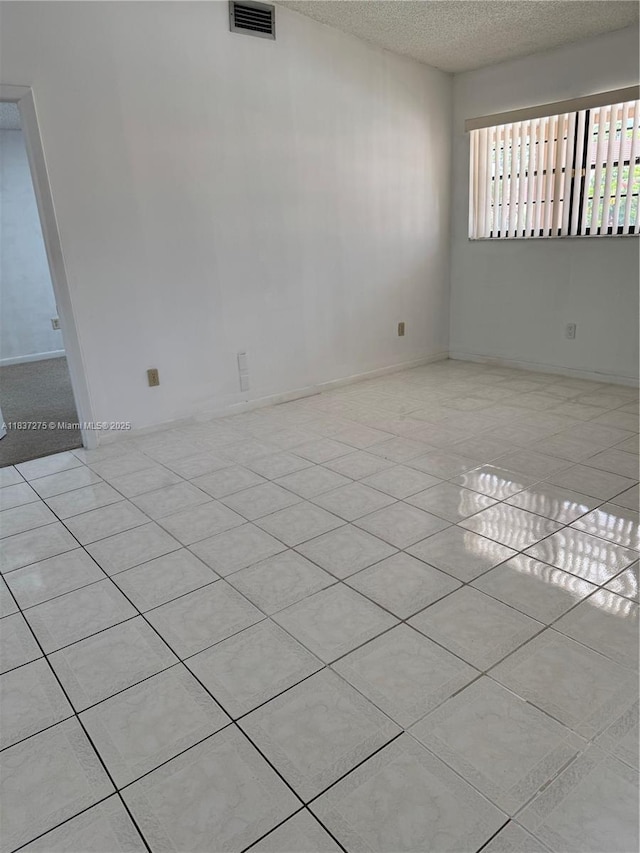 18240 Mediterranean Blvd Unit 5-11, Hialeah, FL 33015 - spare room with a textured ceiling