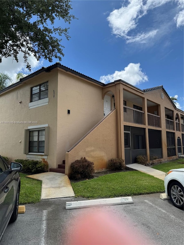 18240 Mediterranean Blvd Unit 5-11, Hialeah, FL 33015 - view of property with uncovered parking