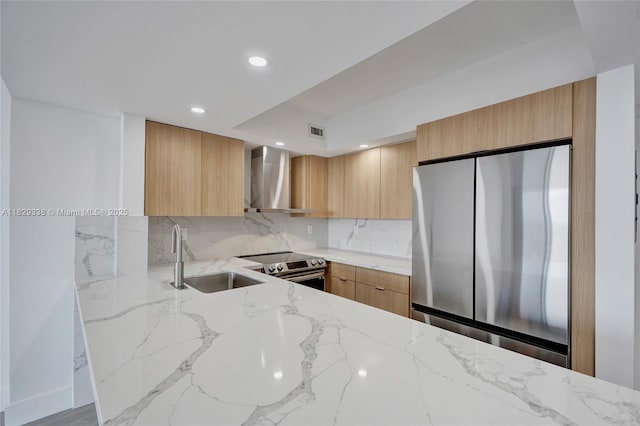 5600 Collins Ave Unit 10L, Miami Beach, FL 33140 - kitchen with appliances with stainless steel finishes, wall chimney range hood, modern cabinets, and recessed lighting