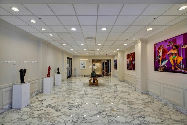 5600 Collins Ave Unit 10L, Miami Beach, FL 33140 - common area featuring a decorative wall, recessed lighting, a wainscoted wall, and crown molding