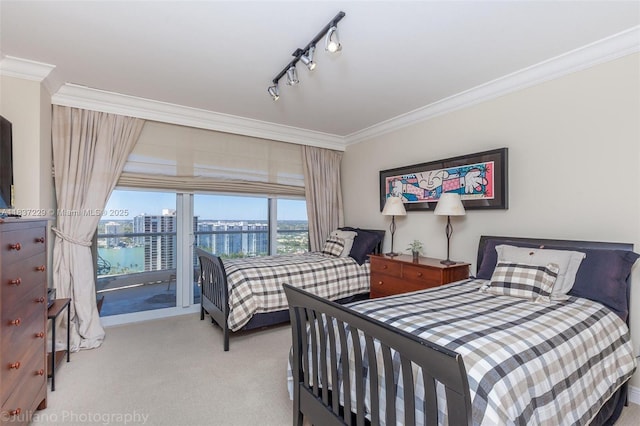 7000 Island Blvd Unit 2504, Aventura, FL 33160 - carpeted bedroom featuring a water view, ornamental molding, access to exterior, and rail lighting