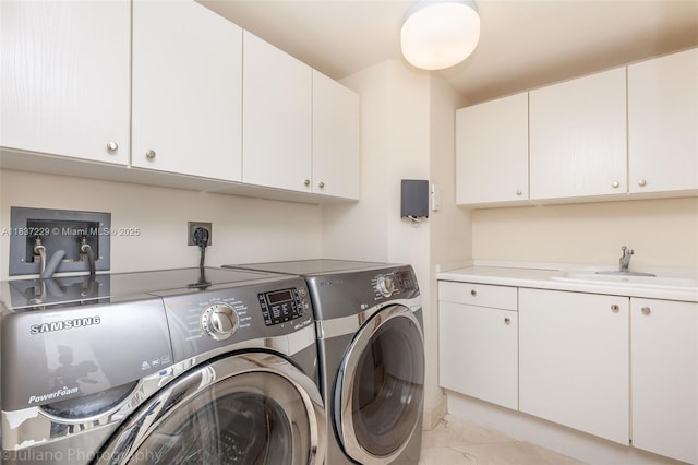 7000 Island Blvd Unit 2504, Aventura, FL 33160 - washroom featuring washer and dryer, cabinet space, and light marble finish flooring
