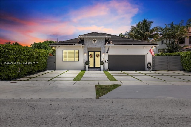 8236 SW 36th St, Miami, FL 33155 - view of front of house with an attached garage, driveway, stucco siding, and a tiled roof