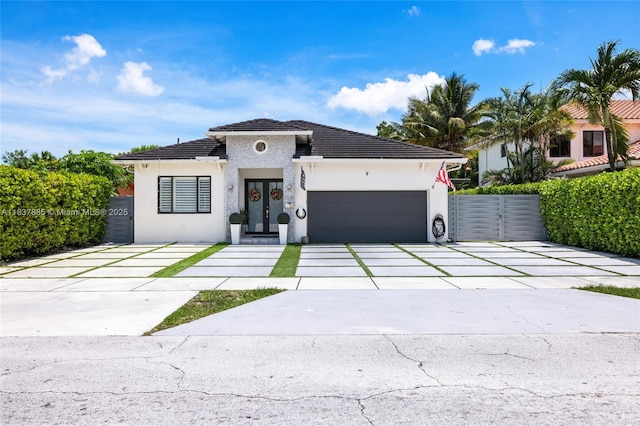 8236 SW 36th St, Miami, FL 33155 - view of front of home featuring a garage, stucco siding, concrete driveway, french doors, and a tiled roof