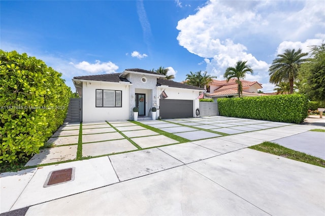 8236 SW 36th St, Miami, FL 33155 - view of front of home featuring driveway, an attached garage, stucco siding, and a tiled roof