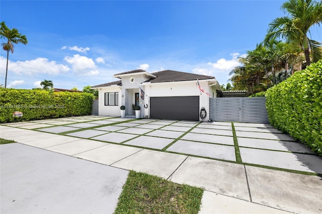 8236 SW 36th St, Miami, FL 33155 - view of front of house featuring stucco siding, driveway, an attached garage, and a tiled roof