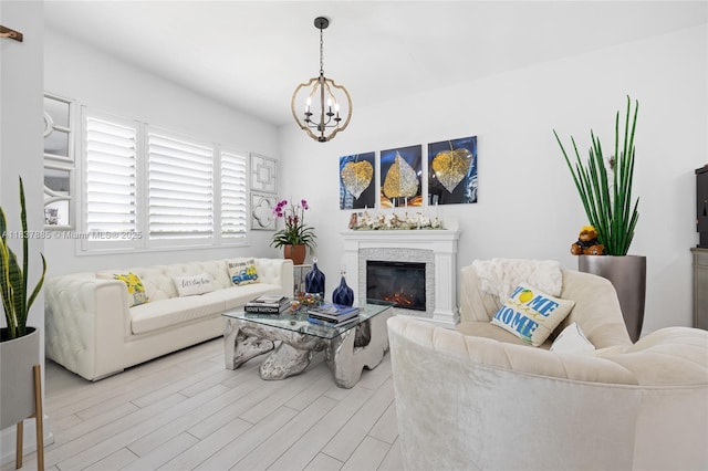 8236 SW 36th St, Miami, FL 33155 - living room featuring a chandelier, wood finished floors, and a glass covered fireplace